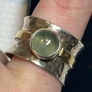Unique sterling silver ring with green stone
Size 8